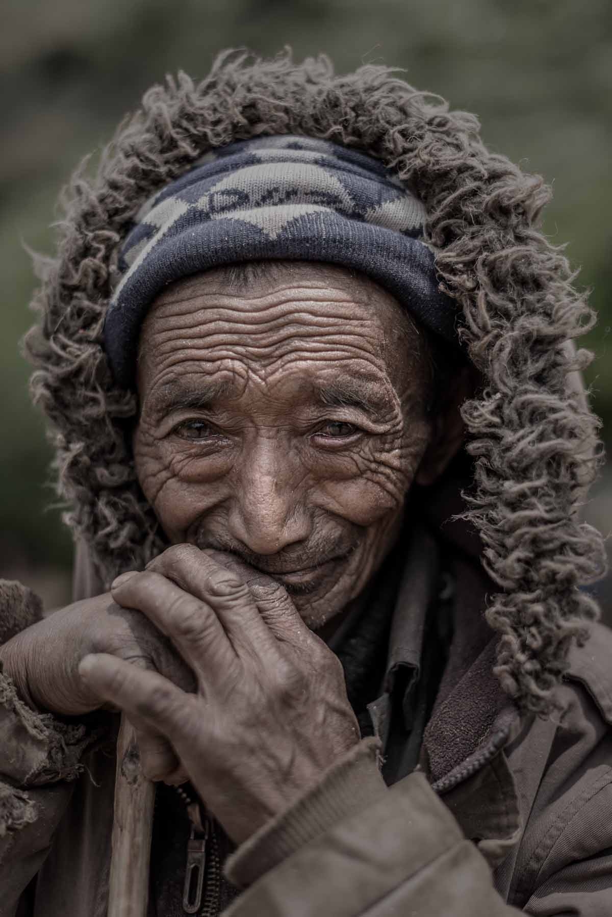 A Nepalese earthquake survivor looks on as relief supplies arrive in the remote Kerauja village in Gorkha district on May 6, 2015. A Nepalese earthquake survivor looks on as relief supplies arrive in the remote Kerauja village in Gorkha district on May 6, 2015.