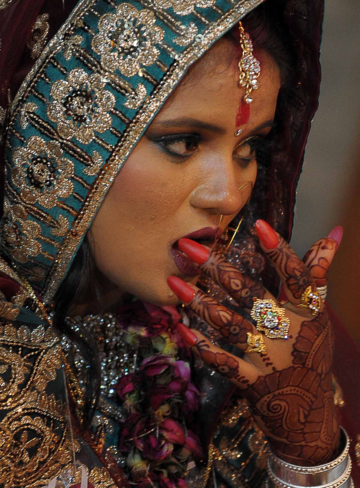 A Pakistani Hindu bride participates in a mass marriage ceremony in Karachi on November 30, 2013. A Pakistani Hindu bride participates in a mass marriage ceremony in Karachi on November 30, 2013.