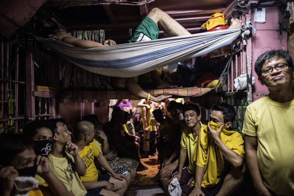 Inmates rest in their sleeping quarters inside the Quezon City jail at night in Manila in this picture taken on July 18, 2016.