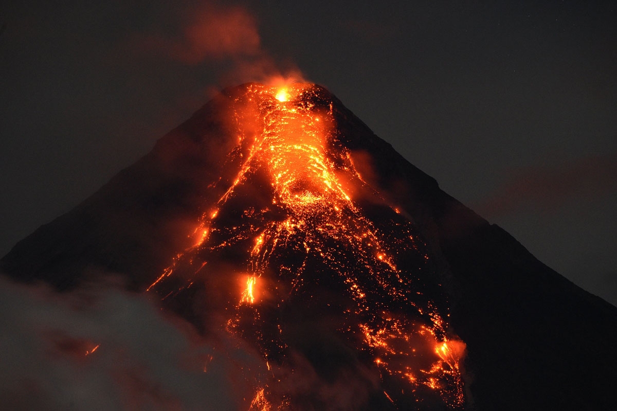 Lave flows from Mayon volcano at it continues to erupt as seen from Legazpi in Albay province, south of Manila, on January 25, 2018.