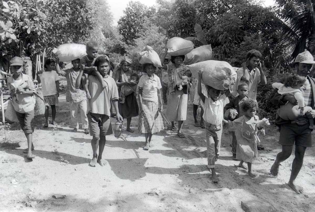 Aeta tribes-people flee their village with their meager belongings, 11 June 1991, in Botolan, which is within the 20-kilometer (12.4 miles) danger zone radius from the erupting Mount Pinatubo volcano. Aeta tribes-people flee their village with their meager belongings, 11 June 1991, in Botolan, which is within the 20-kilometer (12.4 miles) danger zone radius from the erupting Mount Pinatubo volcano.