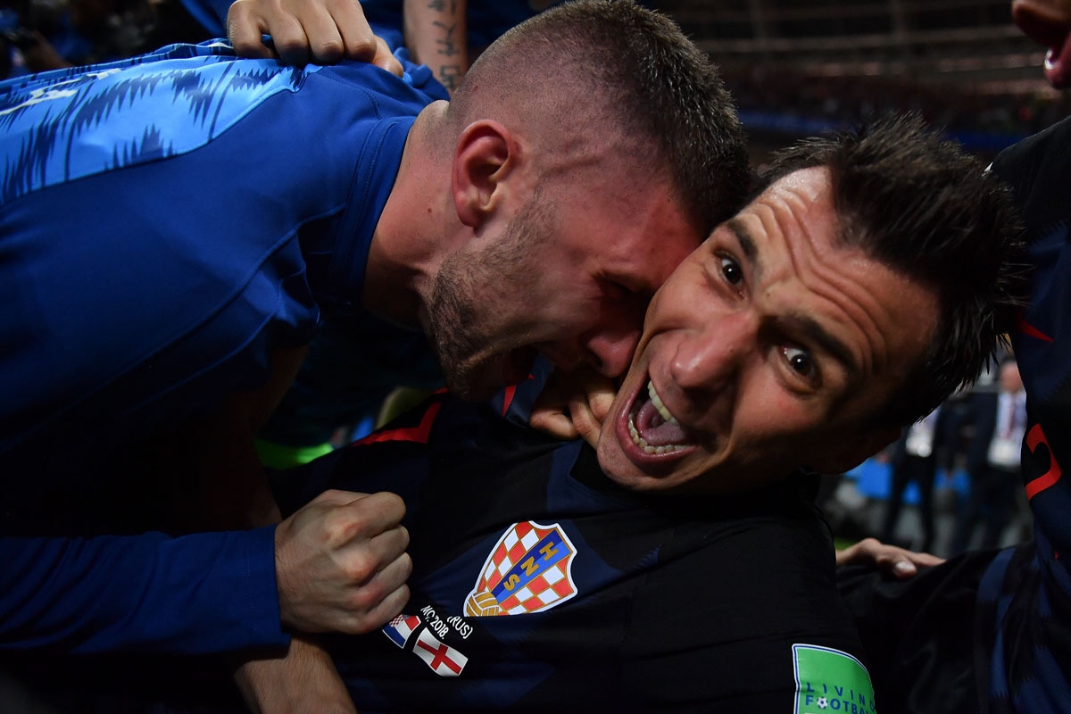 Croatia's forward Mario Mandzukic (R) celebrates with teammates after scoring his team's second goal during the Russia 2018 World Cup semi-final football match between Croatia and England at the Luzhniki Stadium in Moscow on July 11, 2018