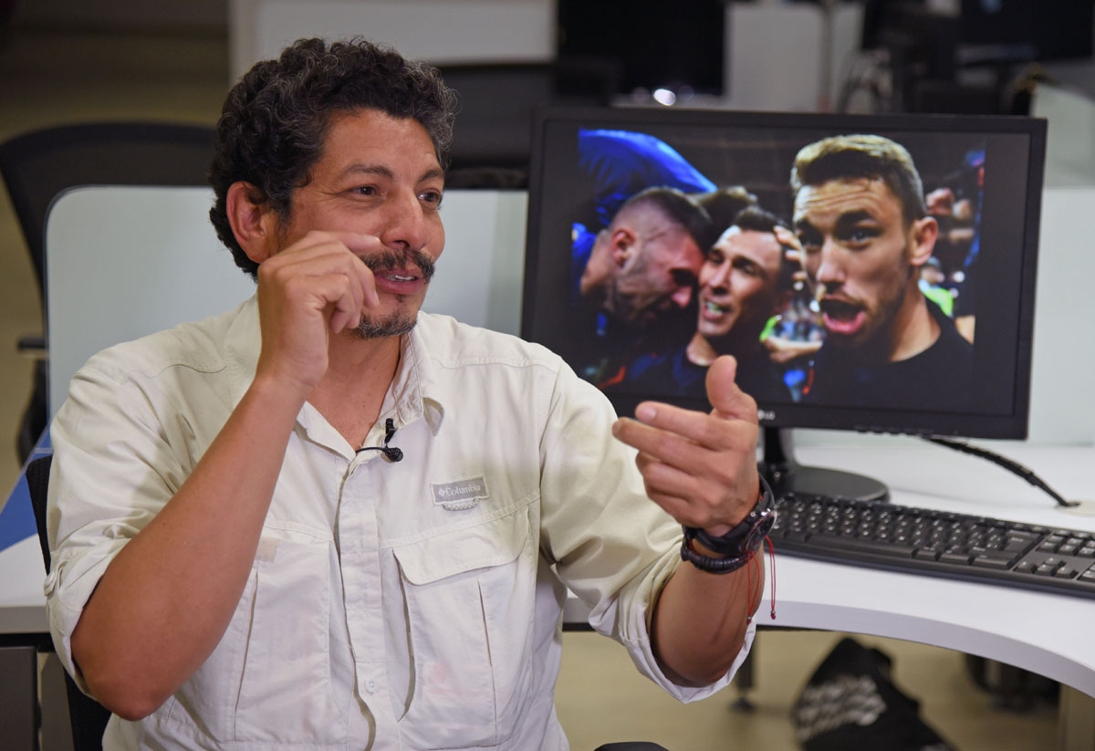 AFP photographer Yuri Cortez, who unwittingly became part of the celebrations of Croatia in their World Cup semi-final match against England, gestures during an interview with AFP in Mexico City on July 12, 2018.