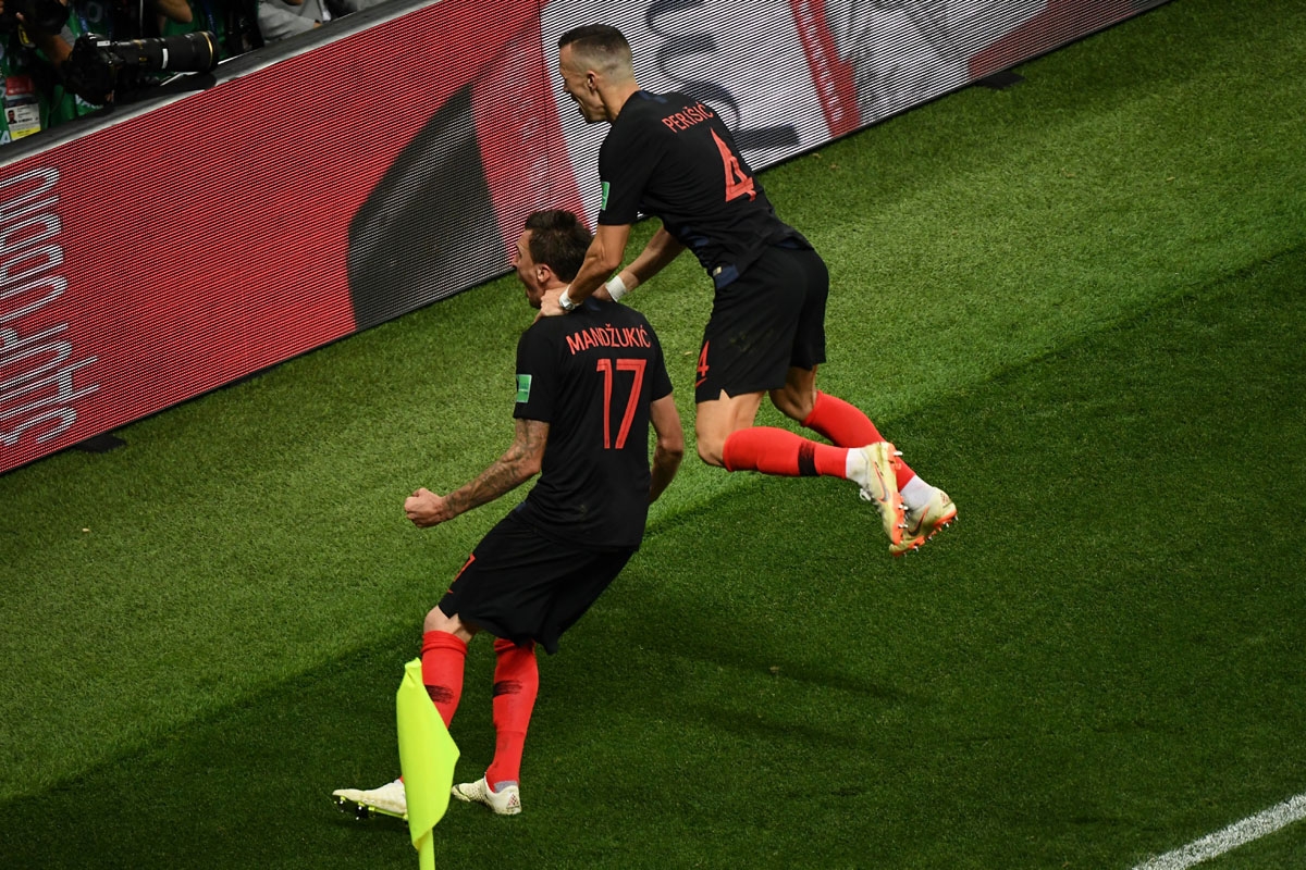 Croatia's forward Mario Mandzukic (L) celebrates with Croatia's forward Ivan Perisic after scoring his team's second goal during the Russia 2018 World Cup semi-final football match between Croatia and England at the Luzhniki Stadium in Moscow on July 11
