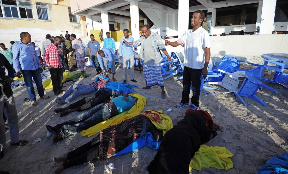 Dead bodies lie on the Lido beach following an overnight attack on the beachfront Lido seafood restaurant in Mogadishu on January 22, 2016.