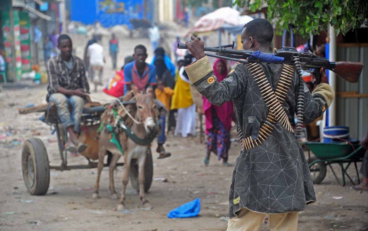 Somalia's soldiers patrol in Afgooye, some 30 kilometres south of the Somali capital, Mogadishu, on October 19, 2016.