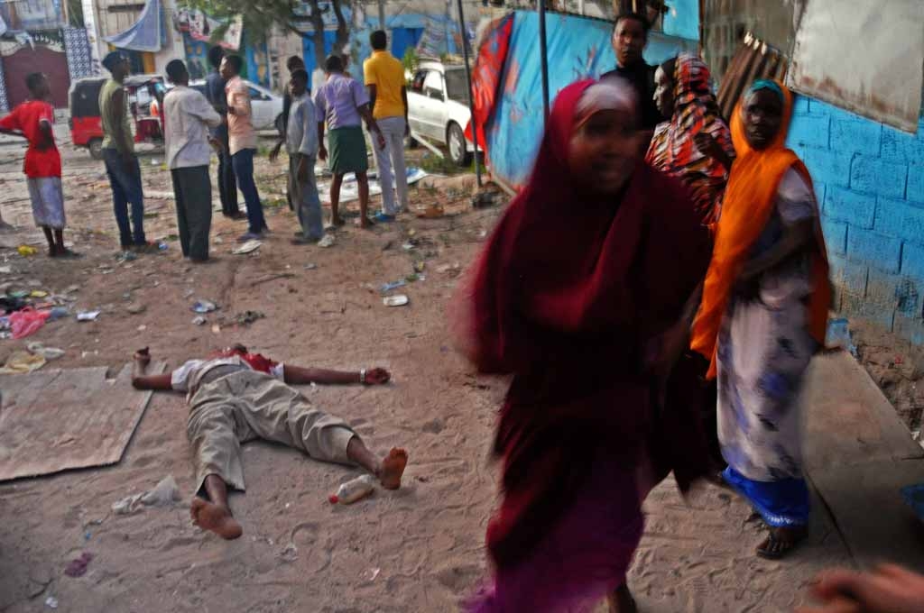 A victim of a terror attack at the Ambassador Hotel lies on the ground, after a car bomb exploded on June 1, 2016 at a top Mogadishu hotel that houses several MPs, killing several people, and followed by a gun battle. A victim of a terror attack at the Ambassador Hotel lies on the ground, after a car bomb exploded on June 1, 2016 at a top Mogadishu hotel that houses several MPs, killing several people, and followed by a gun battle.
