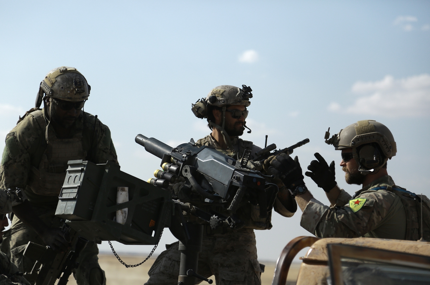 Men in uniform identified by Syrian Democratic forces as US special operations forces ride in the back of a pickup truck in the village of Fatisah in the northern Syrian province of Raqa on May 25, 2016 Men in uniform identified by Syrian Democratic forces as US special operations forces ride in the back of a pickup truck in the village of Fatisah in the northern Syrian province of Raqa on May 25, 2016