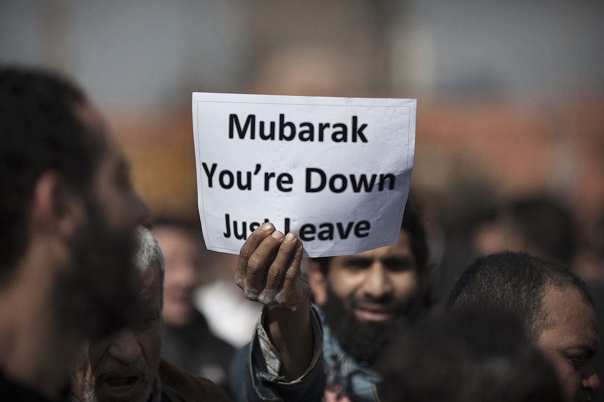 Egyptian demonstrator holds a sign up following prayers in Tahrir Square in Cairo, on January 31, 2011, on the seventh day of mass protests calling for the removal of President Hosni Mubarak.
