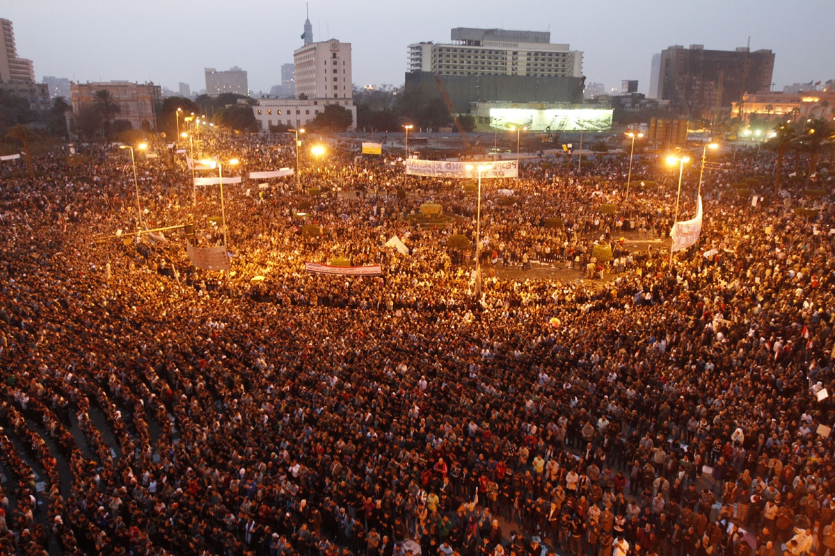 Egyptian protestors take part in a demonstration on February 1, 2011 at Cairoâs Tahrir Square as massive tides of protesters flooded Cairo for the biggest outpouring of anger yet in their relentless drive to oust President Hosni Mubarak's regime.
