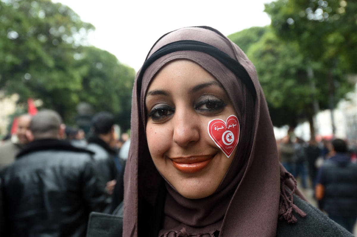 A Tunisian woman attends a demonstration against terrorism on February 21, 2015 in Tunis. Hundreds of people demonstrated Saturday in Tunis against terrorism after an attack that killed four policemen, attributed to jihadists linked to al Qaeda.