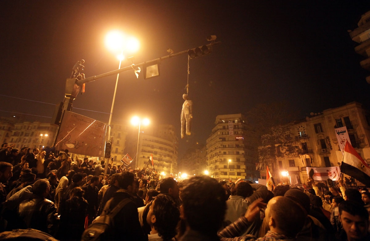 An effigy of Egyptian President Hosni Mubarak hangs over Cairo's Tahrir square following his televised speech on February 1, 2011.