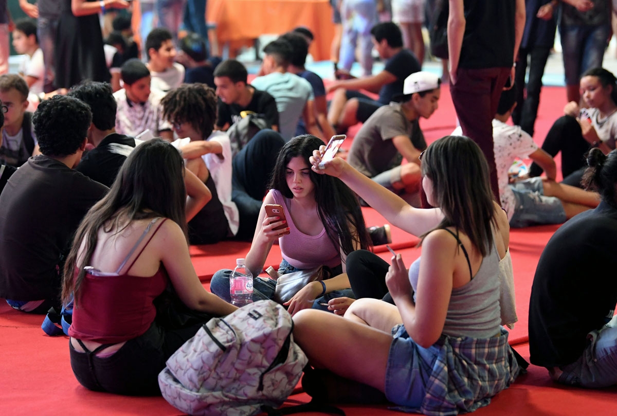 unisian youths attend the closing of the second edition of Comic Con Tunisia on July 9, 2017, in the town of Le Kram, north of Tunis.