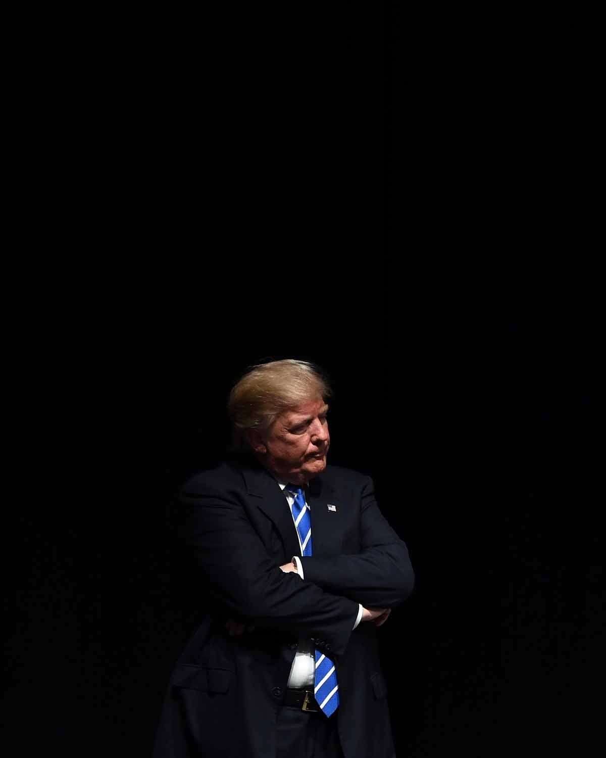 US Republican presidential nominee Donald Trump listens to a speaker during a campaign rally at the at the Mid-America convention centre in Council Bluffs, Iowa, on September 28, 2016. / AFP PHOTO / Jewel SAMAD US Republican presidential nominee Donald Trump listens to a speaker during a campaign rally at the at the Mid-America convention centre in Council Bluffs, Iowa, on September 28, 2016. / AFP PHOTO / Jewel SAMAD