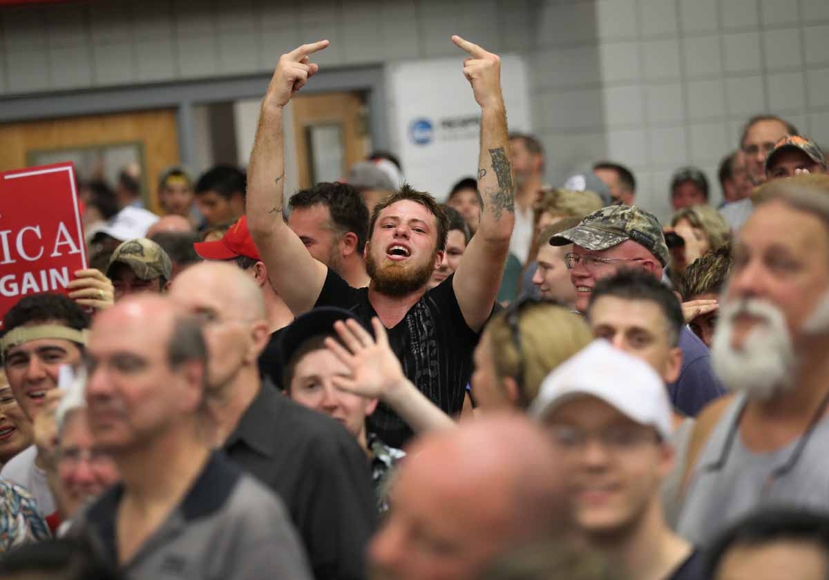 Supporters of Republican Presidential candidate Donald Trump jeer the media on August 13, 2016 in Fairfield, Connecticut. Supporters of Republican Presidential candidate Donald Trump jeer the media on August 13, 2016 in Fairfield, Connecticut.