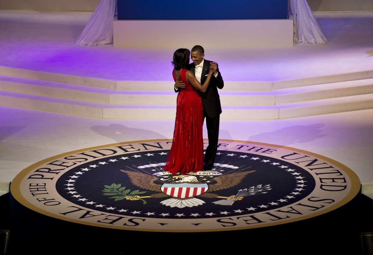 US President Barack Obama and First Lady Michelle Obama dance while attending the Commander and Chief Ball at the Washington Convention Center January 21, 2013 in Washington,