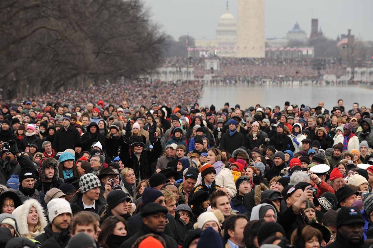 People bundled up against the cold attend the 'We Are One concert, one of the events of US president-elect Barack Obama's inauguration celebrations, at the Lincoln Memorial in Washington on January 18, 2009.
