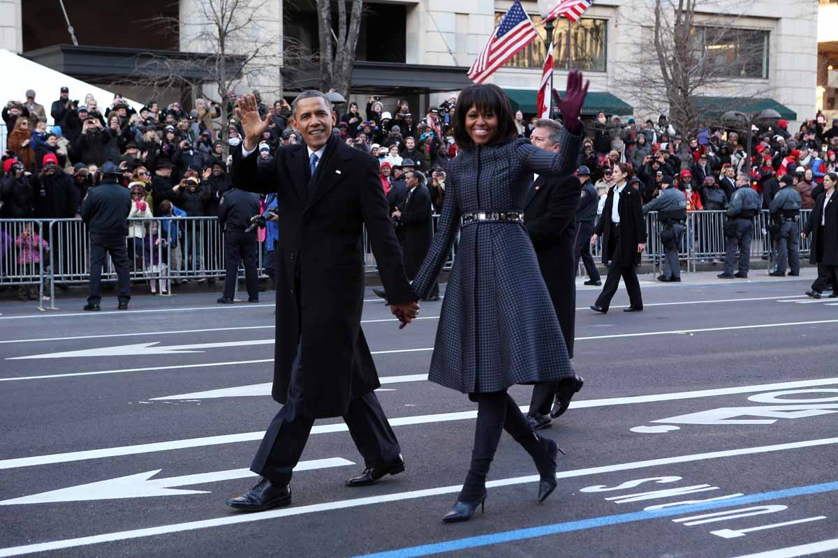 US President Barack Obama and First Lady Michelle Obama walk along Pennsylvania Avenue during the parade following Obama's second inauguration as the 44th US president on January 21, 2013 in Washington, DC.