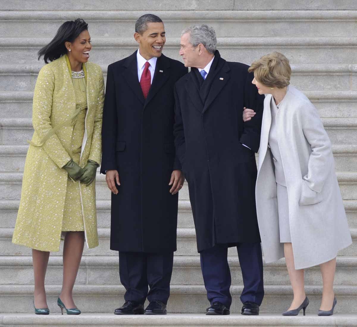 US Presisdent Barack Obama (2nd L), First Lady Michelle Obama (L), former president George W. Bush (2nd R) and former first lady Laura Bush chat on the steps of the Capitol after Obama's Obama's inauguration in Washington on January 20, 2009. AFP PH