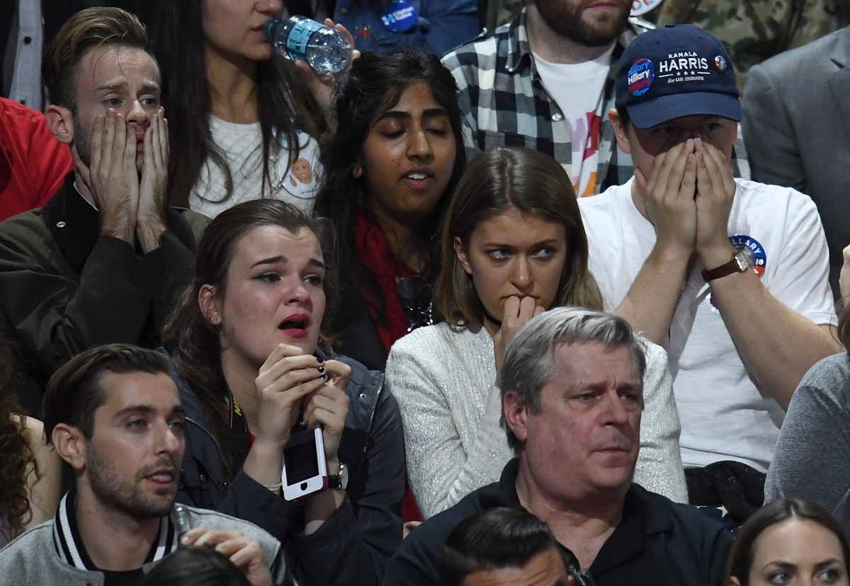 Supporters of Democratic presidential nominee Hillary Clinton react during election night at the Jacob K. Javits Convention Center in New York on November 8, 2016. Supporters of Democratic presidential nominee Hillary Clinton react during election night at the Jacob K. Javits Convention Center in New York on November 8, 2016.