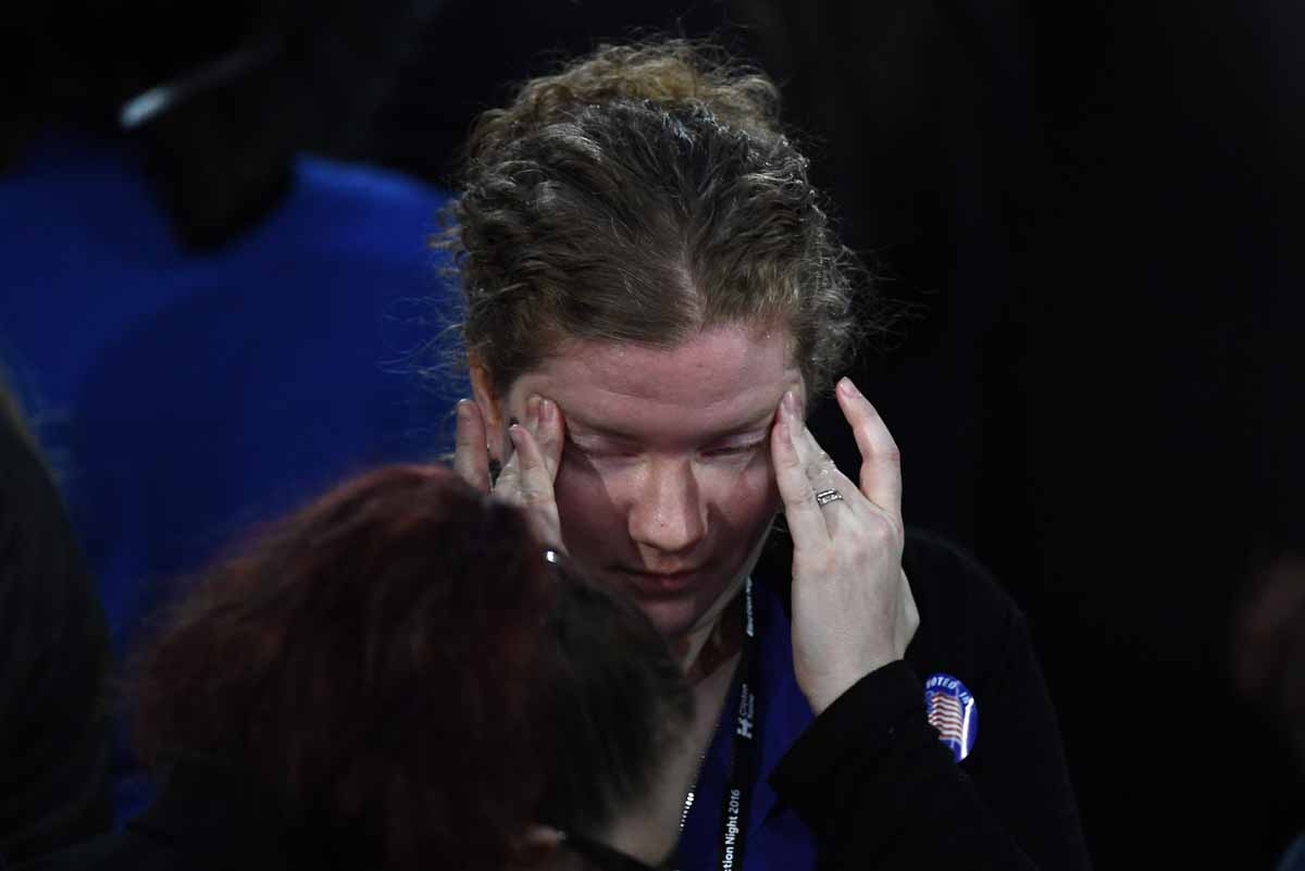 A supporter of Democratic presidential nominee Hillary Clinton reacts during election night at the Jacob K. Javits Convention Center in New York on November 8, 2016. A supporter of Democratic presidential nominee Hillary Clinton reacts during election night at the Jacob K. Javits Convention Center in New York on November 8, 2016.