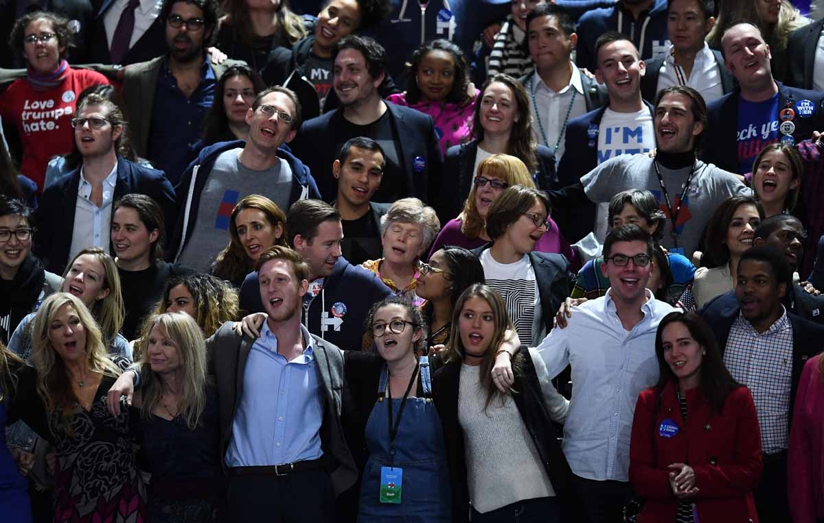 Supporters of Democratic presidential nominee Hillary Clinton sing during election night at the Jacob K. Javits Convention Center in New York on November 8, 2016. Supporters of Democratic presidential nominee Hillary Clinton sing during election night at the Jacob K. Javits Convention Center in New York on November 8, 2016.