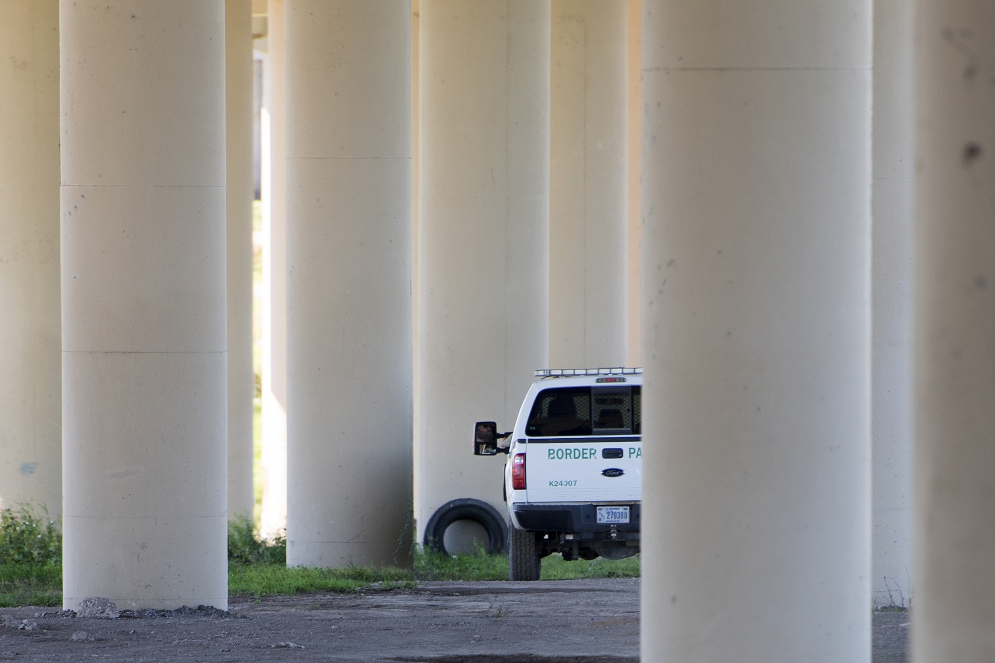 US Border Patrol sits parked under a bridge near the Rio Grande river on the US/Mexico border in Eagle Pass, Texas, on February 21, 2017.
