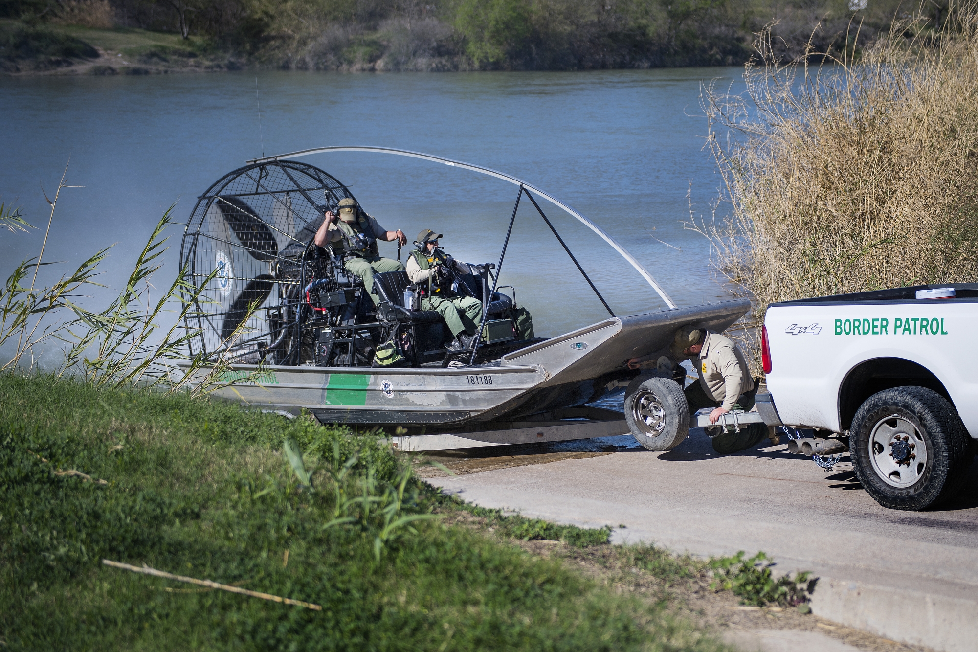 US Border Patrol pull outs of the Rio Grande river on a fan boat on the US/Mexico border in Eagle Pass, Texas, on February 21, 2017