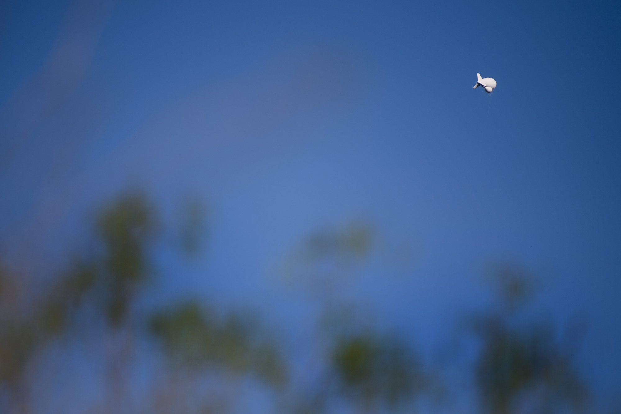 An US Border PatrolTethered Aerostat Radar System (TARS) blimp floats in the air near the US/Mexico border outside Eagle Pass, Texas, on February 22, 2017