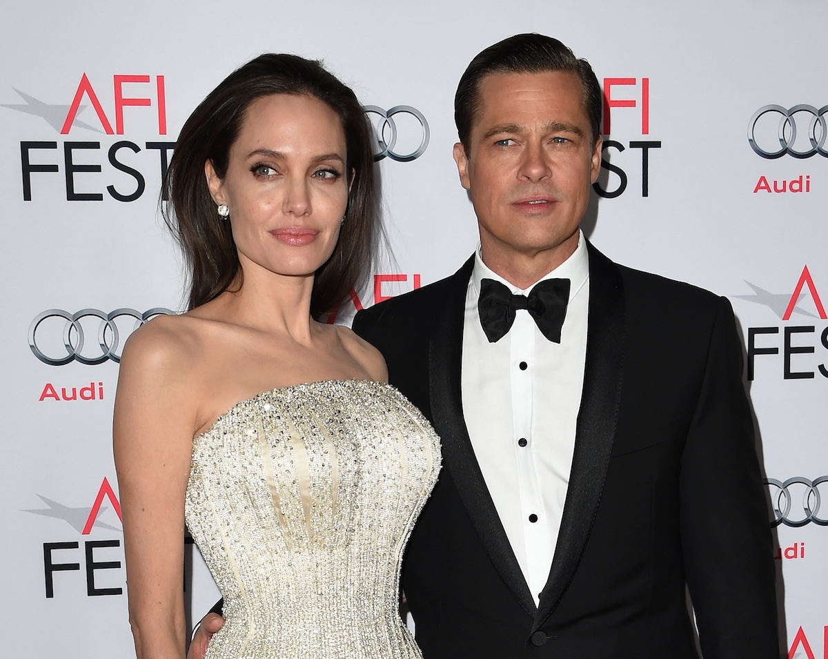 Writer-director-producer-actress Angelina Jolie Pitt (L) and actor-producer Brad Pitt arrive for the opening night gala premiere of Universal Pictures' 'By the Sea' during AFI FEST 2015 presented by Audi at the TCL Chinese Theatre in Hollywood, California