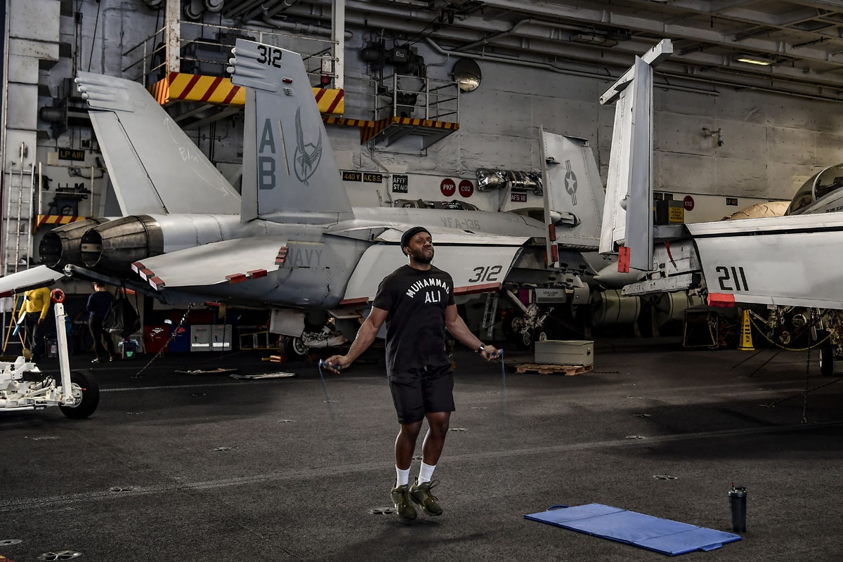 A member of the 330 meters aircraft carrier Harry S Truman works out under the deck of the warship on eastern Mediterranean Sea on May 8, 2018.
