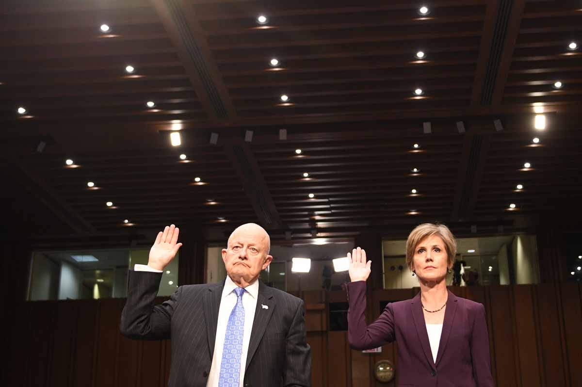 Former acting Attorney General Sally Yates (R) and former Director of National Intelligence James Clapper (L) are sworn in prior to testifying on May 8, 2017, before the US Senate Judiciary Committee on Capitol Hill in Washington, DC. /