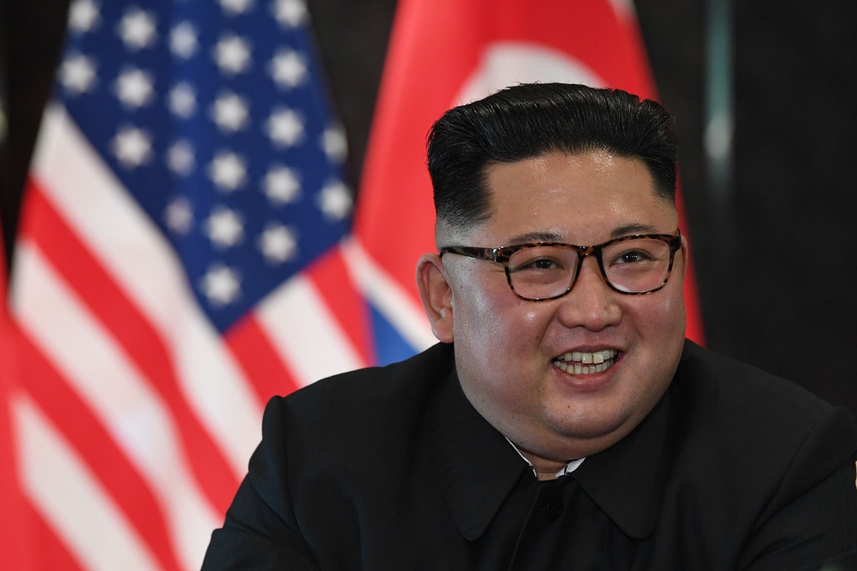 North Korea's leader Kim Jong Un reacts at a signing ceremony with US President Donald Trump (not pictured) during their historic US-North Korea summit, at the Capella Hotel on Sentosa island in Singapore on June 12, 2018.