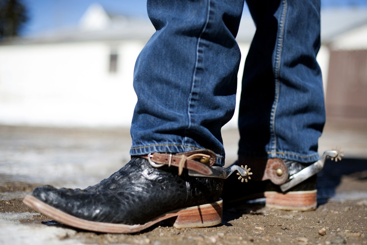 A rider displays his ornate cowboy boots and spurs before riding in the 68th annual Leadville Ski Joring weekend competition on Saturday, March 4, 2017 in Leadville, Colorado.