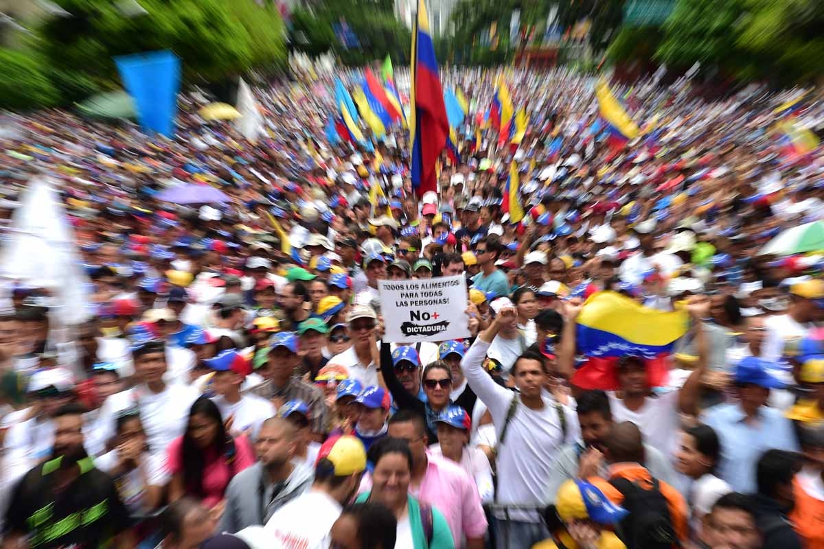 Venezuelan opposition activists taks part in a march against President Nicolas Maduro, in Caracas on May 1, 2017.