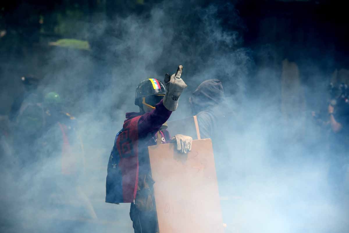 An opposition activist gestures during a march against President Nicolas Maduro, in Caracas on May 1, 2017.