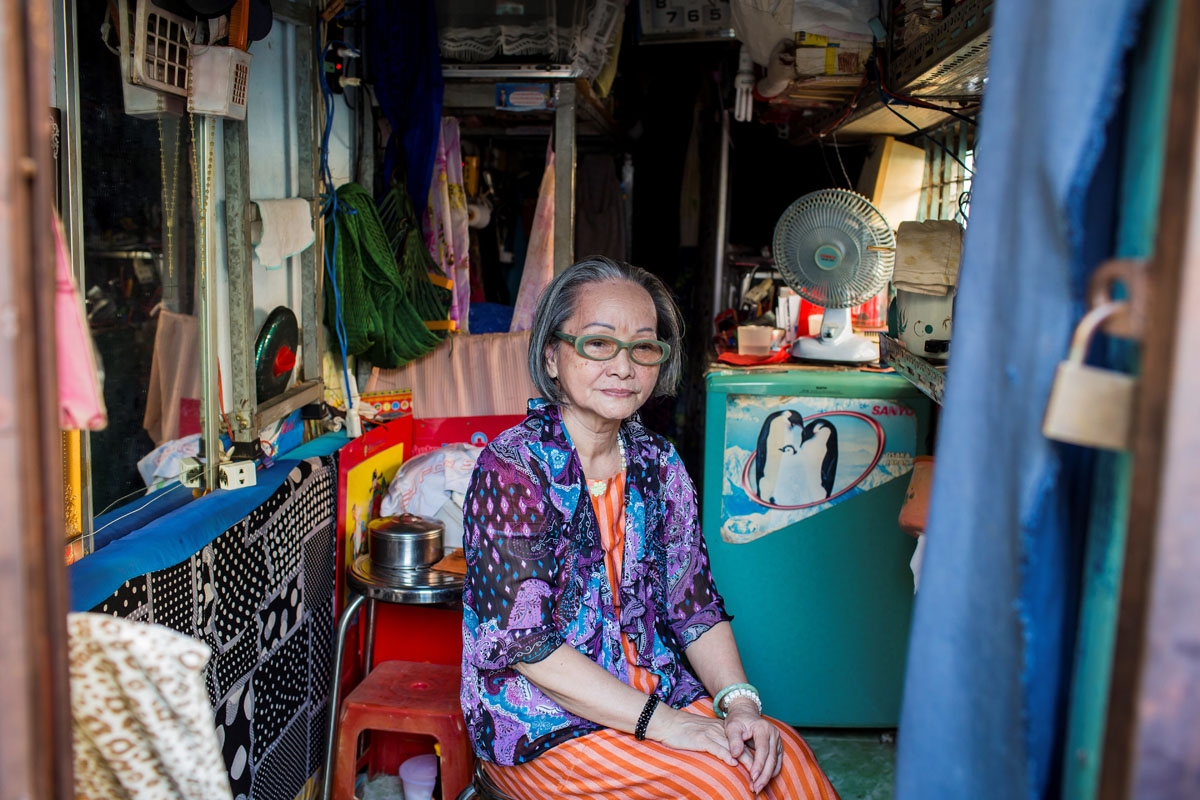 Nguyen Thi Tanh, 75, poses in her 6.7-square-meter home in Ho Chi Minh City on April 24, 2018.