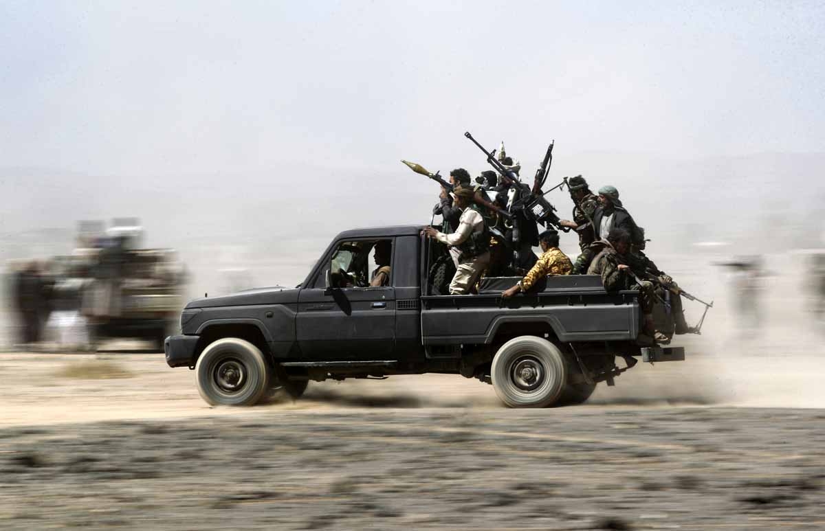 Armed Yemeni tribesmen loyal to the Shiite Huthi rebels sit in the back of an armed vehicle during a gathering to mobilise more fighters into several battlefronts on November 1, 2016 on the outskirts of the capital Sanaa. Armed Yemeni tribesmen loyal to the Shiite Huthi rebels sit in the back of an armed vehicle during a gathering to mobilise more fighters into several battlefronts on November 1, 2016 on the outskirts of the capital Sanaa.
