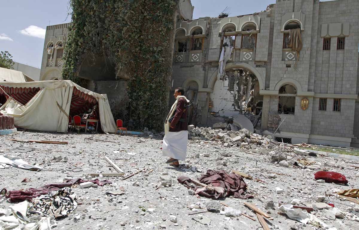 A gunmen loyal to former Yemeni President Ali Abdullah Saleh, stands amid the wreckage of Saleh's residence following reported air strikes on his residence, on May 10, 2015, in the capital Sanaa. A gunmen loyal to former Yemeni President Ali Abdullah Saleh, stands amid the wreckage of Saleh's residence following reported air strikes on his residence, on May 10, 2015, in the capital Sanaa.