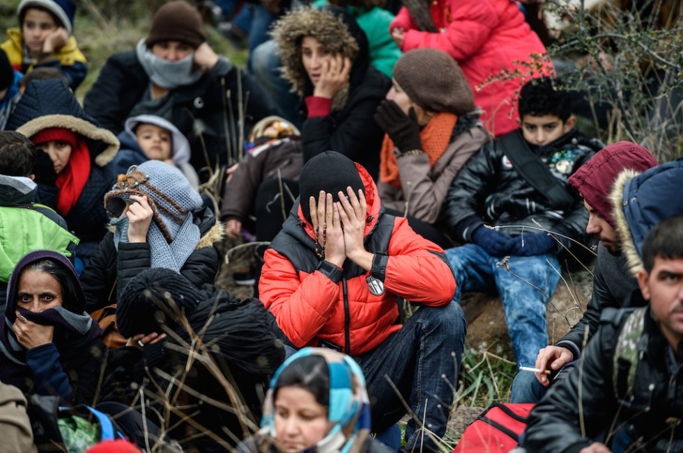 Migrants wait in the woods after being cheated by smugglers. January 29, 2016. Migrants wait in the woods after being cheated by smugglers. January 29, 2016.
