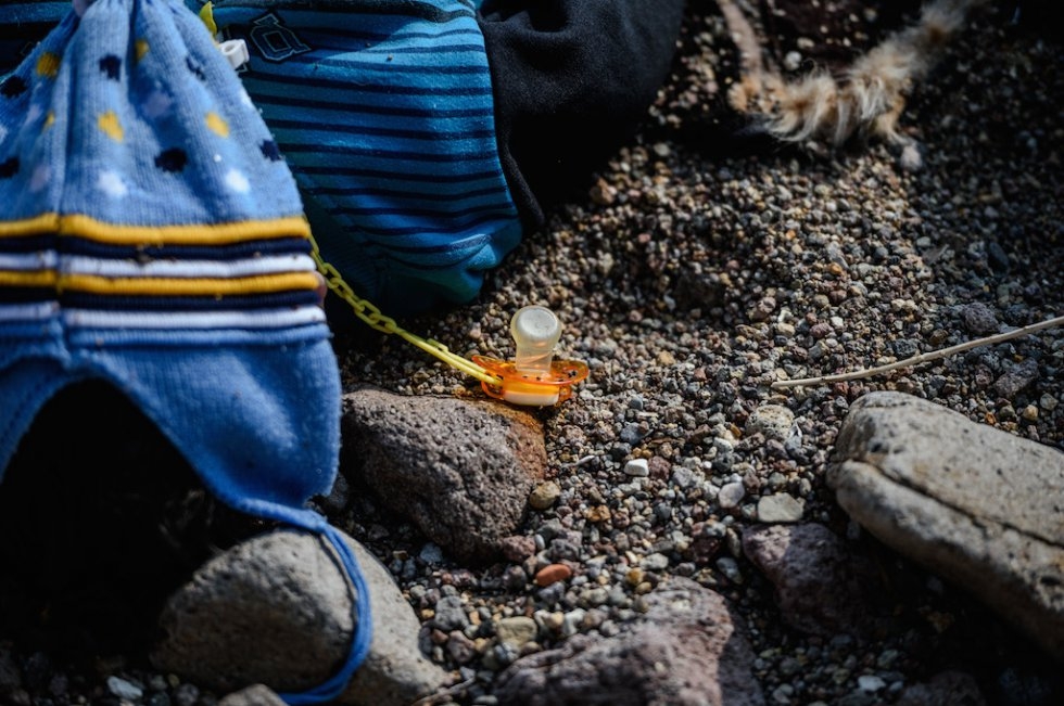 The pacifier attached to the clothes of a drowned refugee baby boy. January 30, 2016. The pacifier attached to the clothes of a drowned refugee baby boy. January 30, 2016.