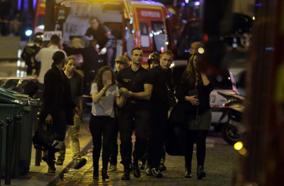 Rescuers evacuate people following the attacks. Rescuers evacuate people following the attacks.