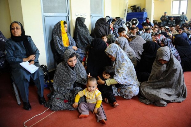 Women prisoners hold their children as they await release from a prison in Herat on May 6, 2014. Women prisoners hold their children as they await release from a prison in Herat on May 6, 2014.