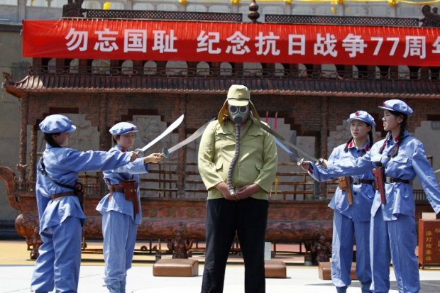 Chinese women dressed up as the Women's Detachment of the Red Army accept the surrender of a Japanese soldier during a different performance in Luanchuan, central China's Henan province. Chinese women dressed up as the Women's Detachment of the Red Army accept the surrender of a Japanese soldier during a different performance in Luanchuan, central China's Henan province.