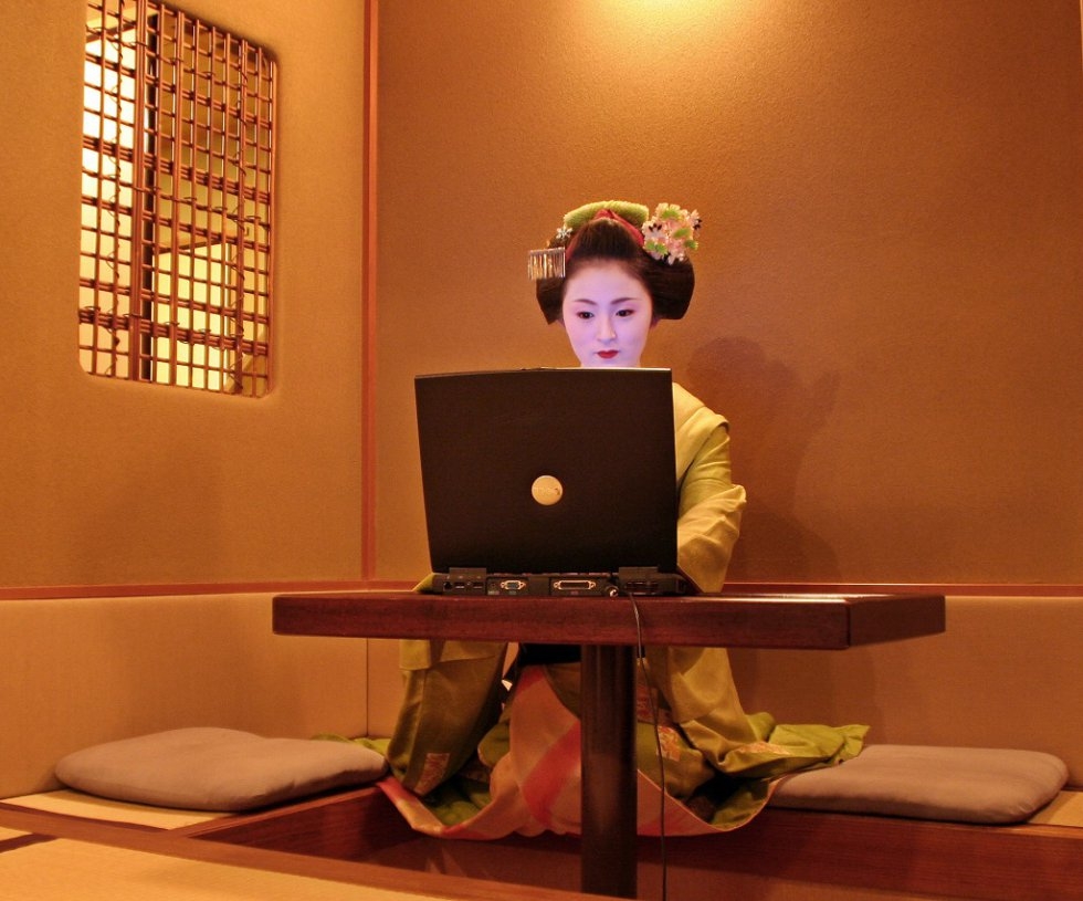 A geisha apprentice in front of her computer at a Kyoto teahouse in December, 2006. A geisha apprentice in front of her computer at a Kyoto teahouse in December, 2006.