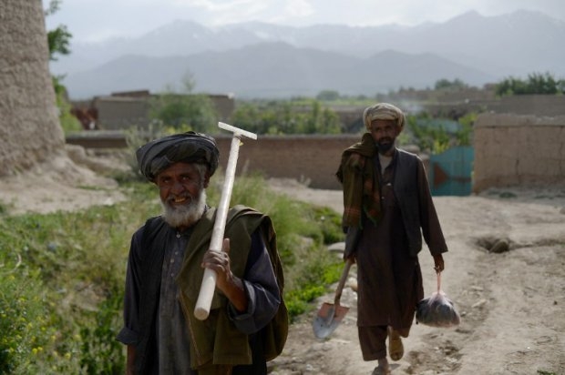Afghan farmers near destroyed buildings in the village of Deh Saqi on The Shomali Plains Afghan farmers near destroyed buildings in the village of Deh Saqi on The Shomali Plains
