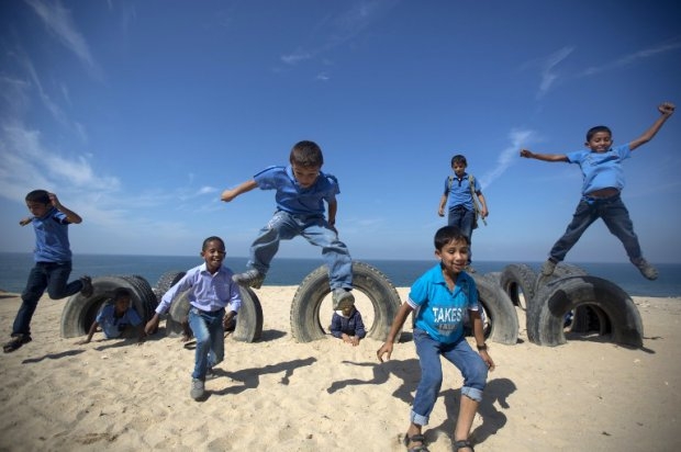 Last year: Palestinian school children play with on Gaza beach on October 24, 2013 in Deir al-Balah. Last year: Palestinian school children play with on Gaza beach on October 24, 2013 in Deir al-Balah.