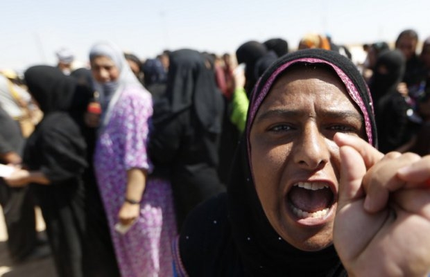 A displaced Iraqi woman shouts as she waits to register at a temporary camp set up to shelter people fleeing violence in northern Iraq on June 17, 2014 in Aski kalak, 40 kms west of the Kurdish autonomous region's capital Arbil. (AFP Photo/Karim Sahib) A displaced Iraqi woman shouts as she waits to register at a temporary camp set up to shelter people fleeing violence in northern Iraq on June 17, 2014 in Aski kalak, 40 kms west of the Kurdish autonomous region's capital Arbil. (AFP Photo/Karim Sahib)