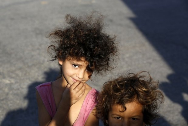 Displaced Palestinian children pose for a picture in Gaza City on July 26, 2014. Displaced Palestinian children pose for a picture in Gaza City on July 26, 2014.