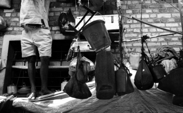 An inmate next to his possessions in Gisovu. October 31, 2001. An inmate next to his possessions in Gisovu. October 31, 2001.